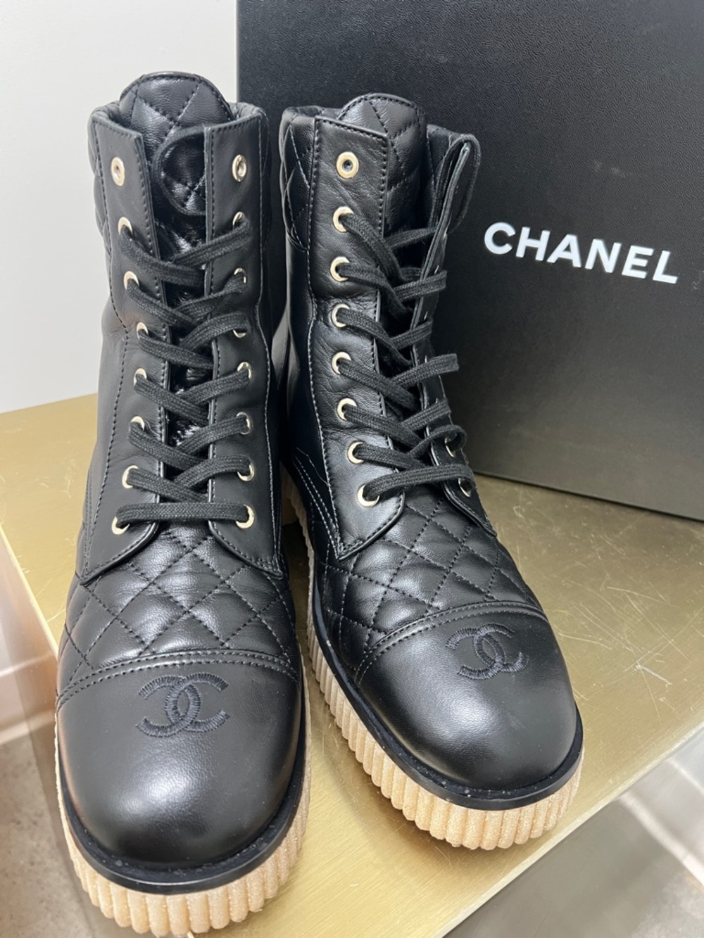 CHANEL Black Quilted Leather Lace-Up Ankle Boots with Cream Ribbed Sole
